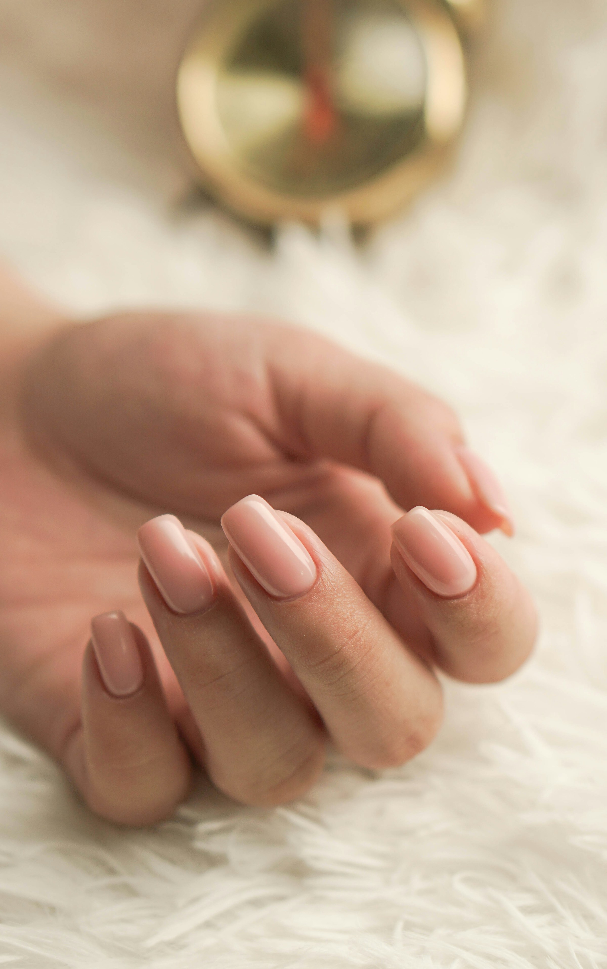 Close-up of an elegant nude manicure